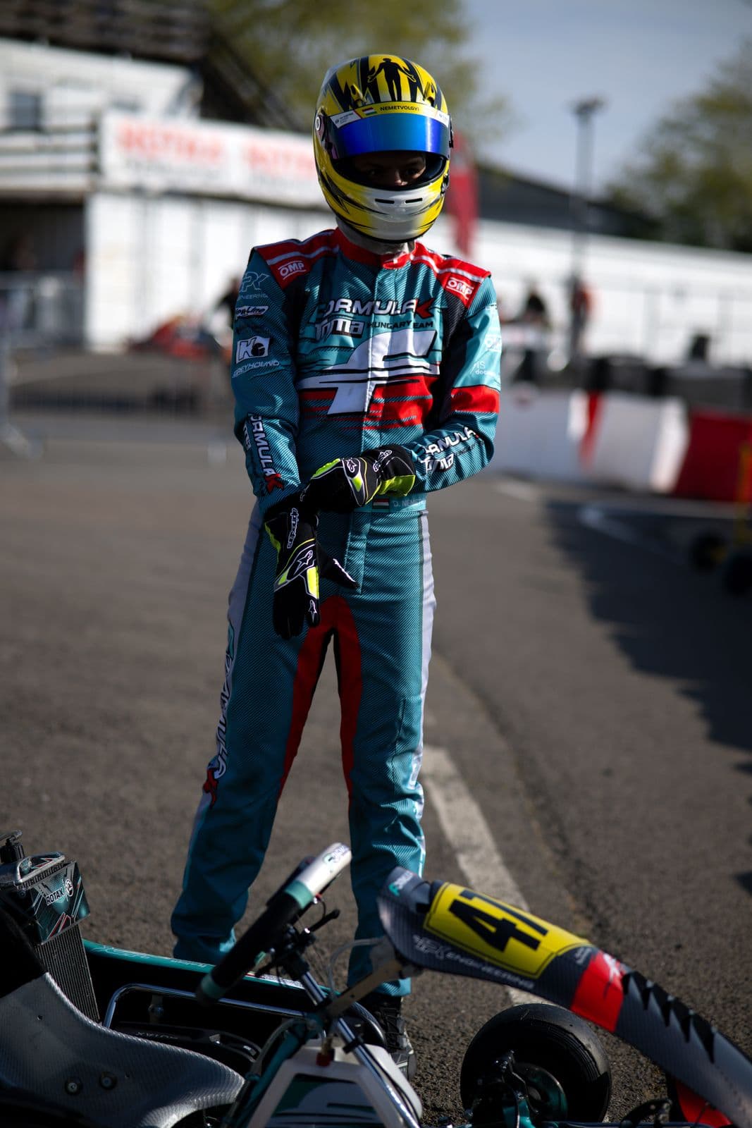 Donát in his helmet next to his kart, Visonta