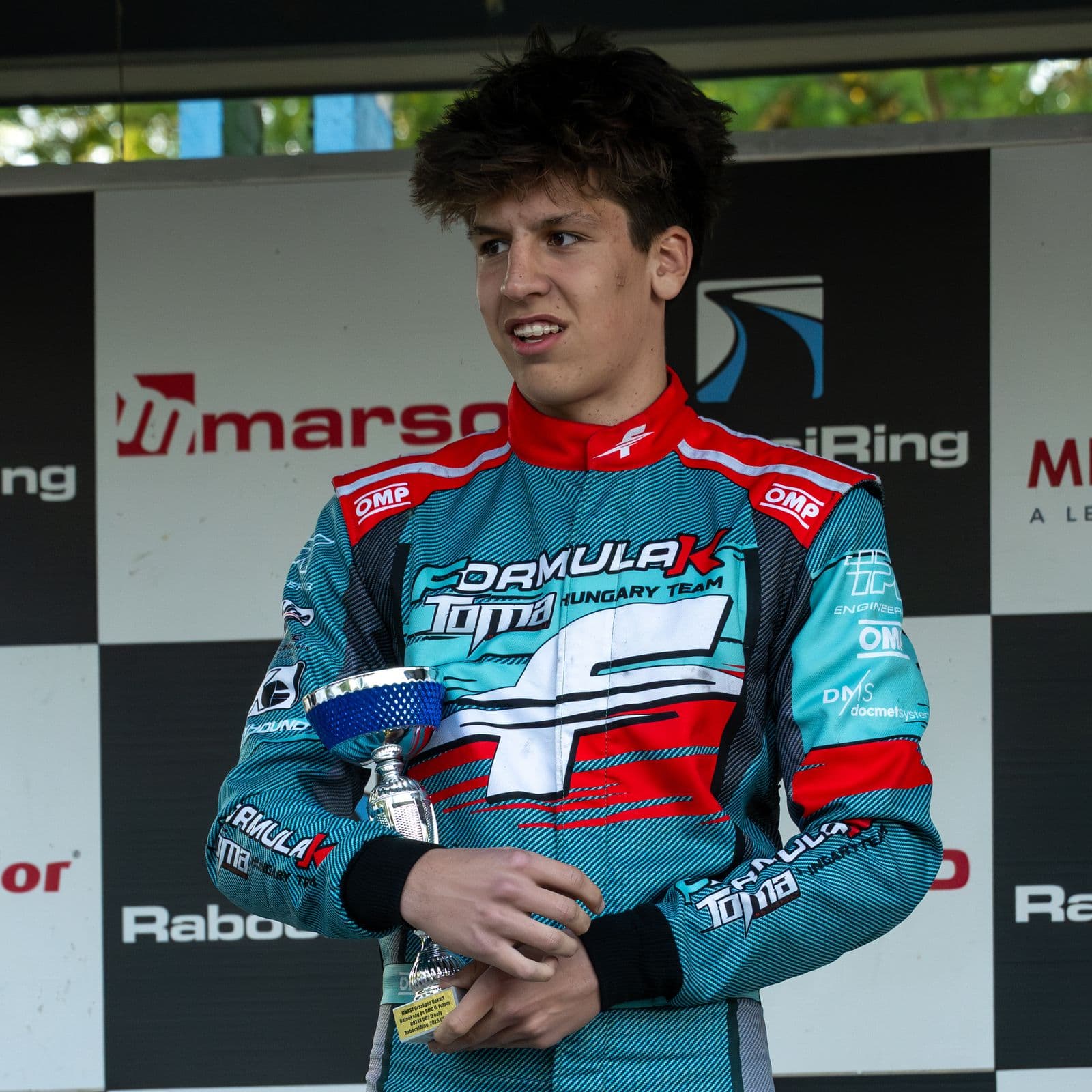 Donát with a trophy at the prize-giving, Rabócsiring