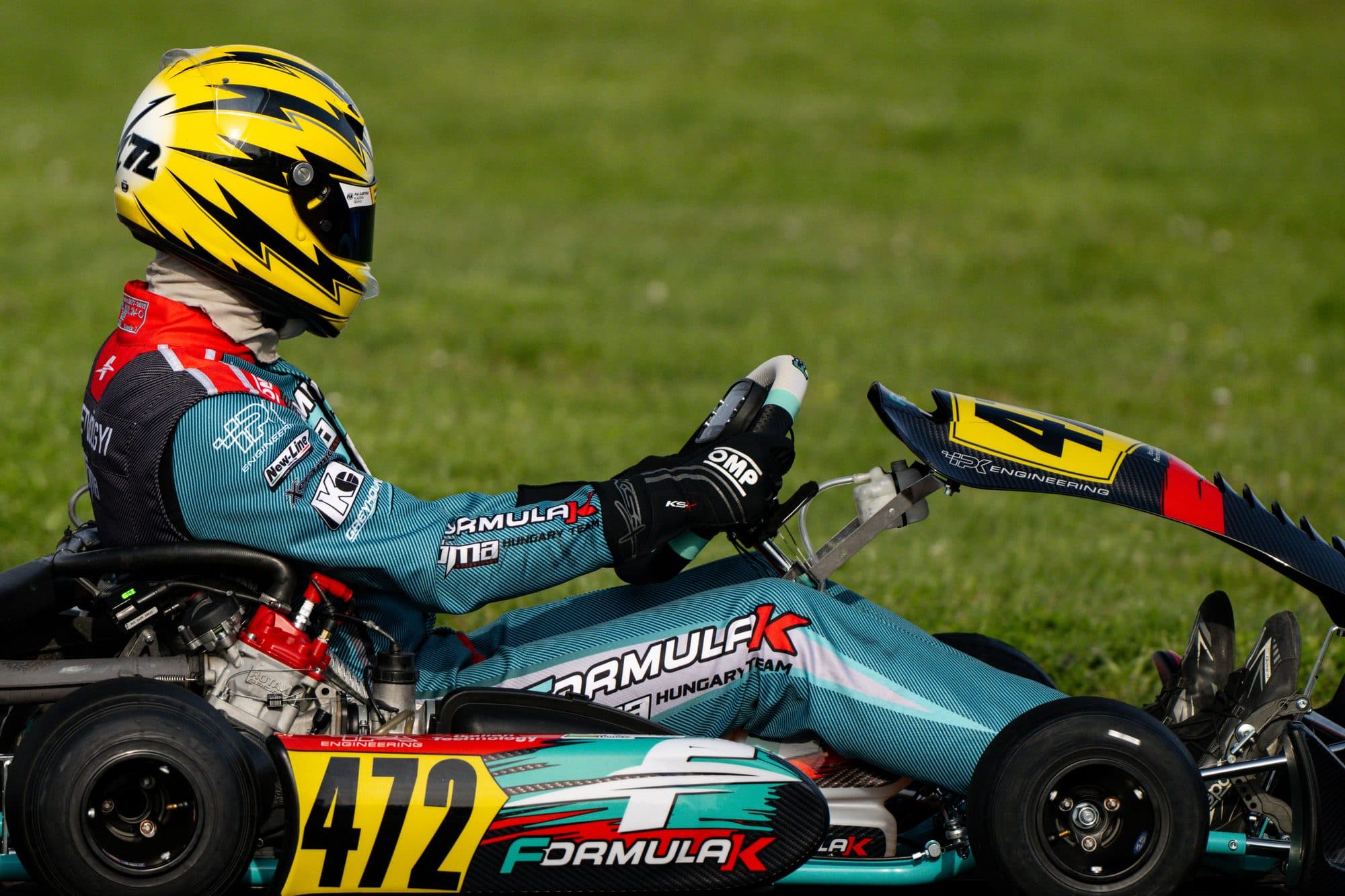 Kart #472 side-on against the grass verge, Visonta
